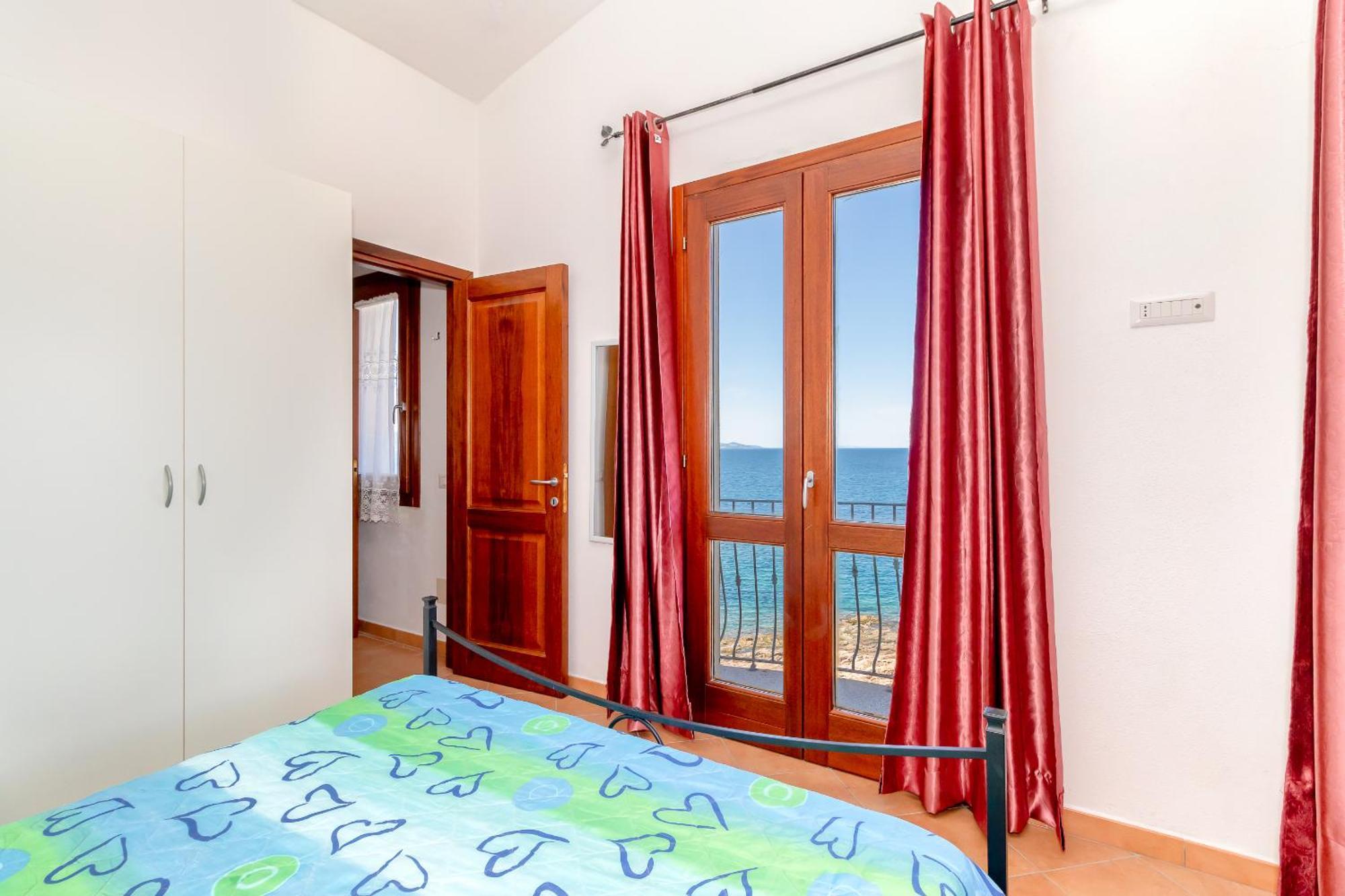 Casa Sulla Scogliera Isola Rossa Apartment Exterior foto